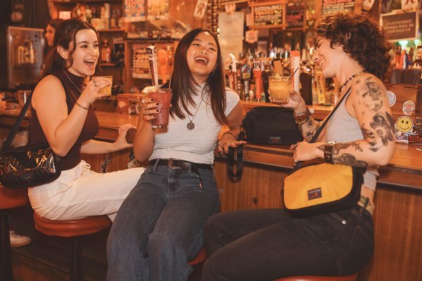 People at a nightlife establishment holding the Big Bantam